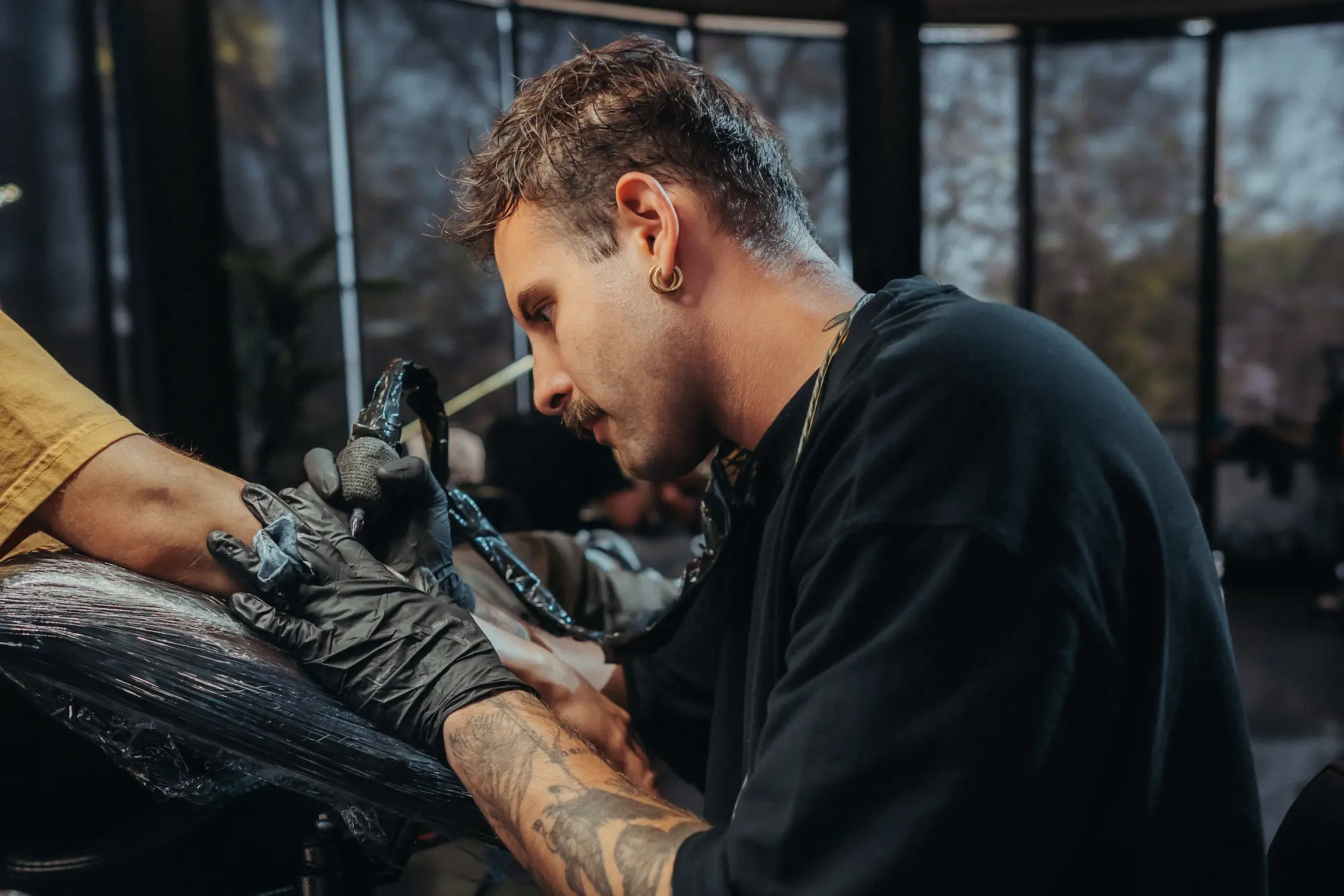 Portrait picture of Diconeme posing at Ganga Tattoo Studio Los Angeles